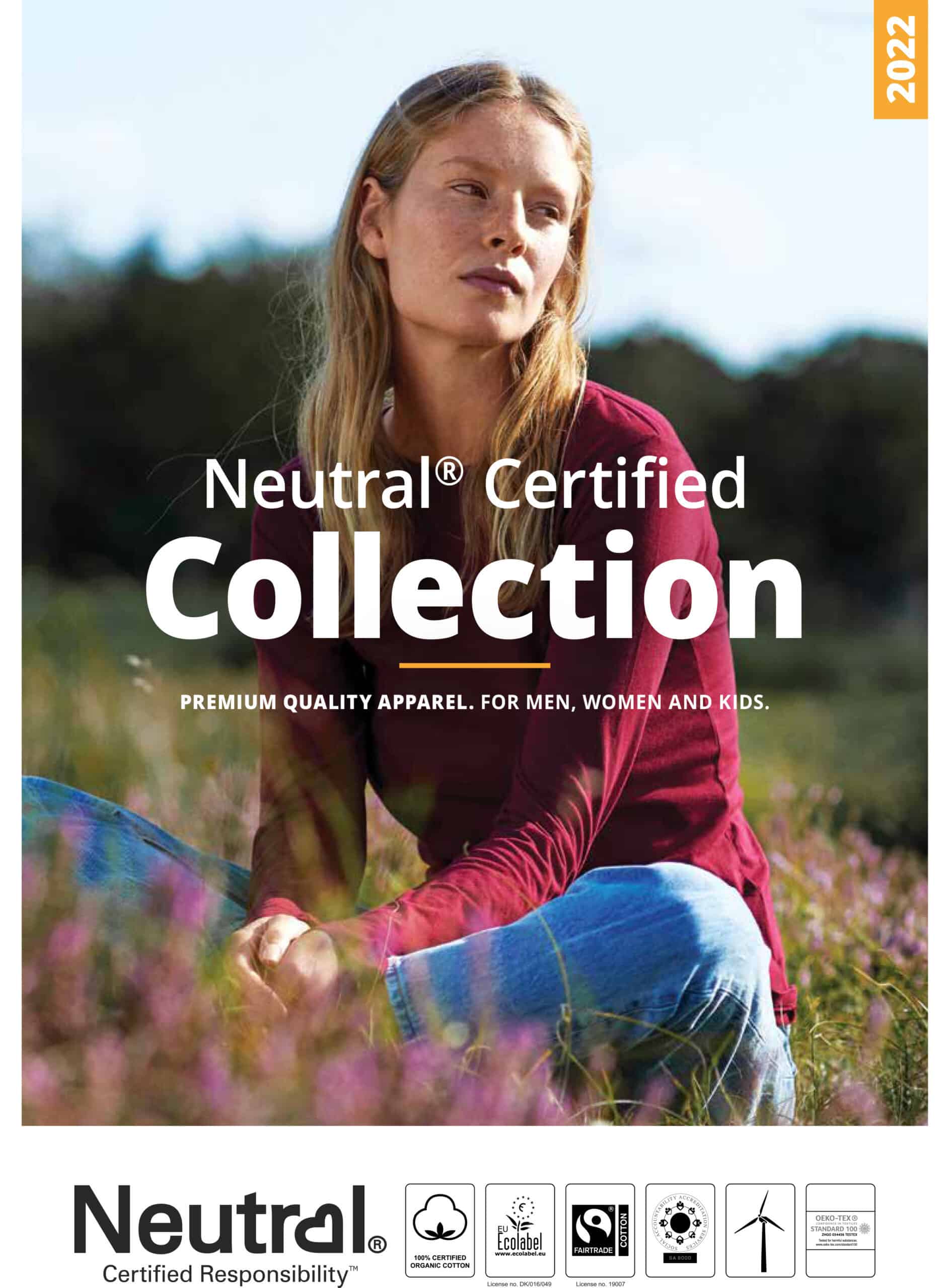 neutral-catalogue-cover-woman-in-red-sweater-and-blue-jeans-in-a-grass-field-2022